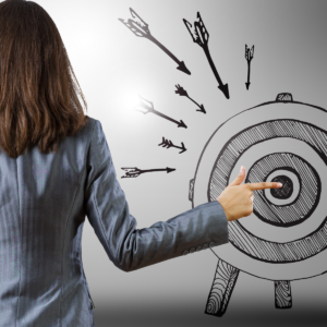 Woman pointing to bullseye of a target