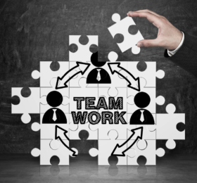 Puzzle Pieces that show the word Teamwork
