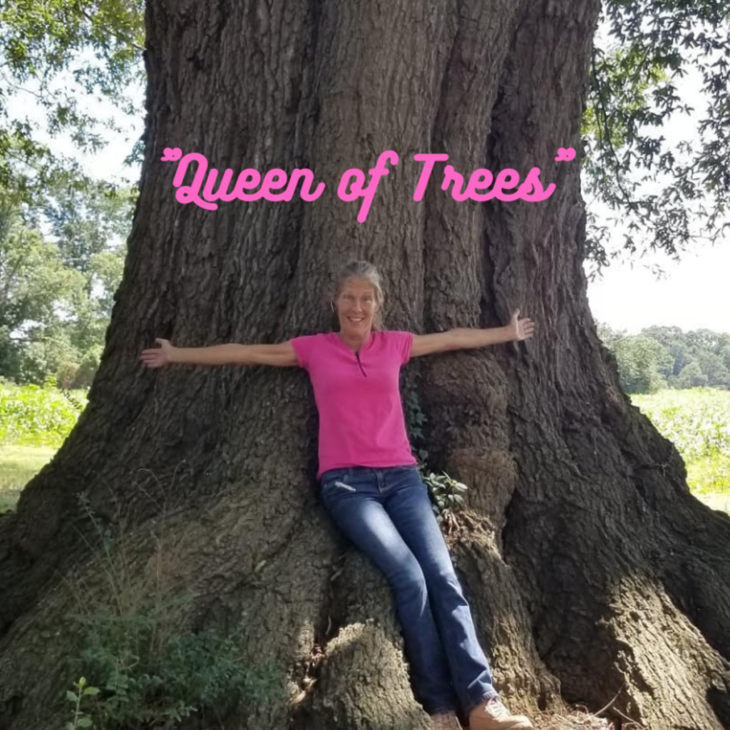 Mandi Wolfe in front of a large tree