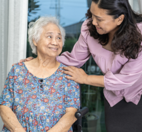 Woman caring for elderly woman