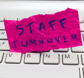Note paper with the words Staff Turnover on it